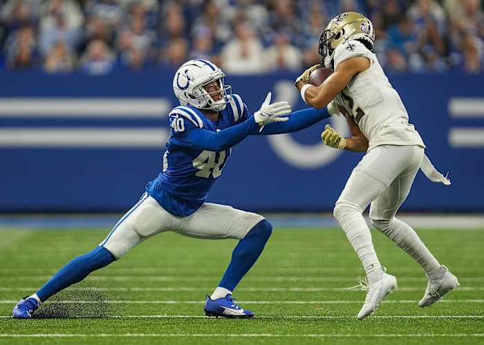 Indianapolis Colts cornerback Jaylon Jones (40) moves in on New Orleans Saints wide receiver Chris Olave (12) as he carries the ball Sunday, Oct. 29, 2023, at Lucas Oil Stadium in Indianapolis. The Colts lost to the Saints, 38-27.